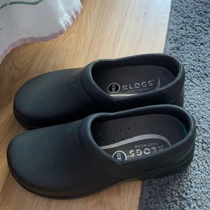 Black waterproof clogs.